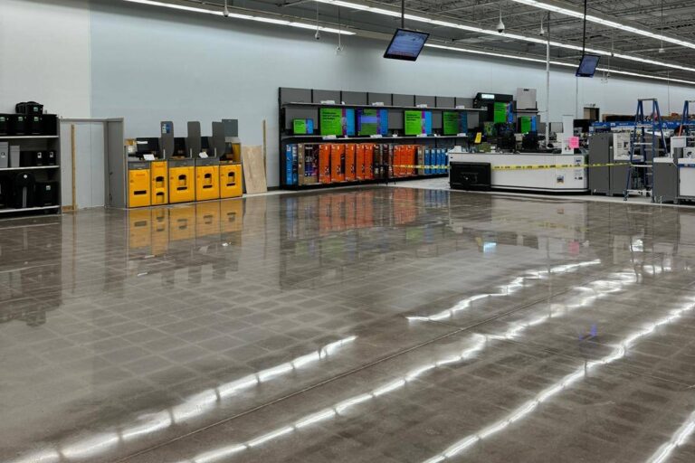 Durable polished concrete industrial floor, high reflectivity in retail space.