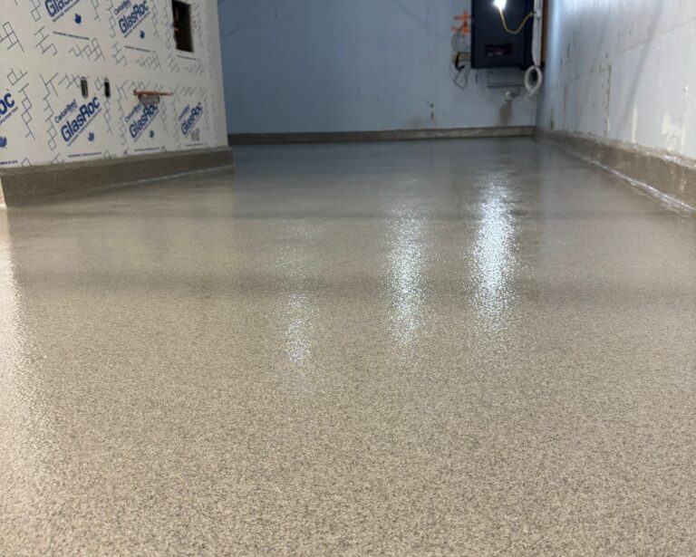 Light beige speckled industrial epoxy floor, durable high-performance coating.