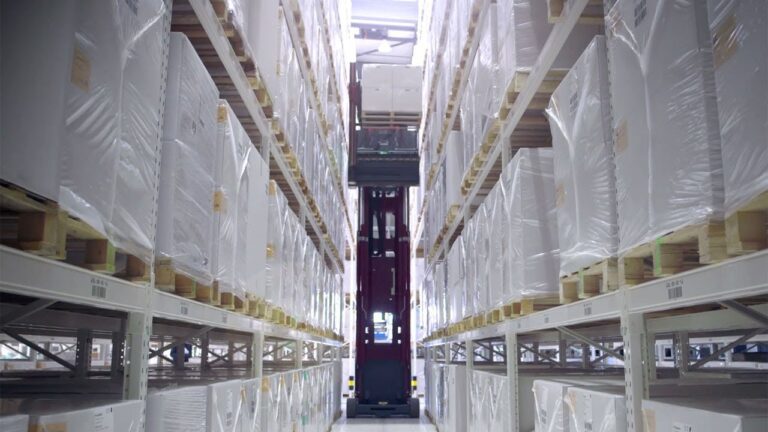 Automated warehouse, narrow aisle, high-bay storage, forklift, durable industrial flooring.
