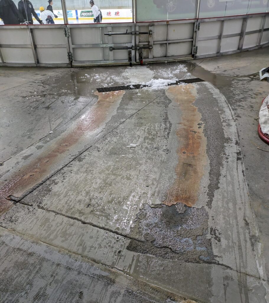 The damaged rink entrance area before...